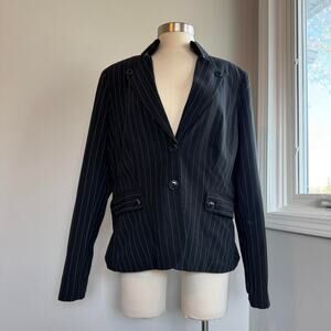 Black pinstripe blazer with lots of buttons and shoulder pads